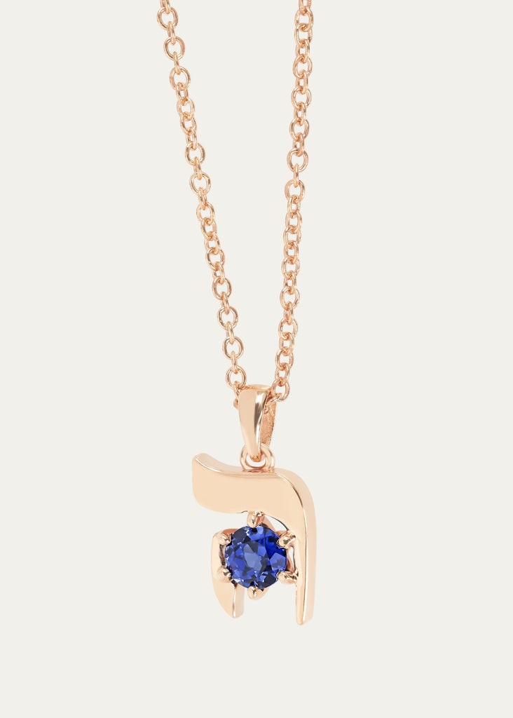 Close-up shot of Hebrew HEI necklace with round-cut sapphire and rose gold Rolo chain
