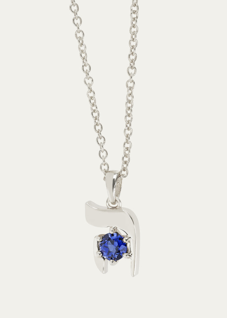 Detailed view of HEI pendant in 18K  white solid gold with blue sapphire gemstone
